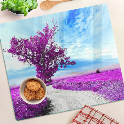 Tabla para cortar Árbol morado contra el cielo