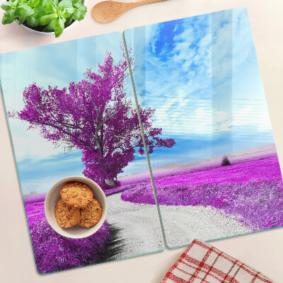 Tabla para cortar Árbol morado contra el cielo