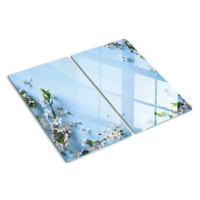 Tabla de cortar de cristal Patrón floral sobre fondo azul.