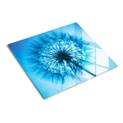 Tabla de cortar de cristal Diente de león sobre fondo azul