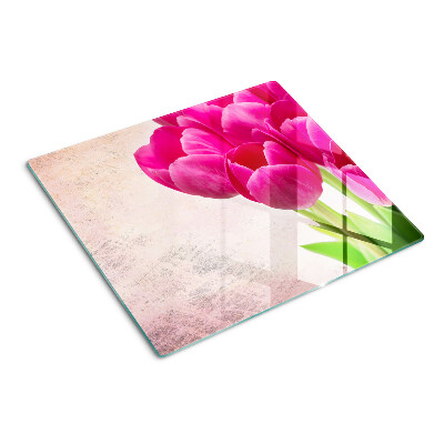 Tabla para cortar Flores de tulipán sobre un fondo rosa