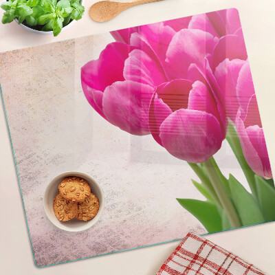 Tabla para cortar Flores de tulipán sobre un fondo rosa