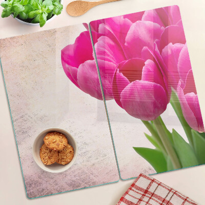 Tabla para cortar Flores de tulipán sobre un fondo rosa
