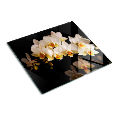 Tabla de cortar de cristal Orquídeas sobre fondo negro