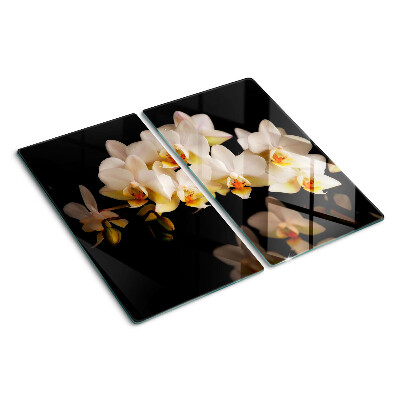 Tabla de cortar de cristal Orquídeas sobre fondo negro
