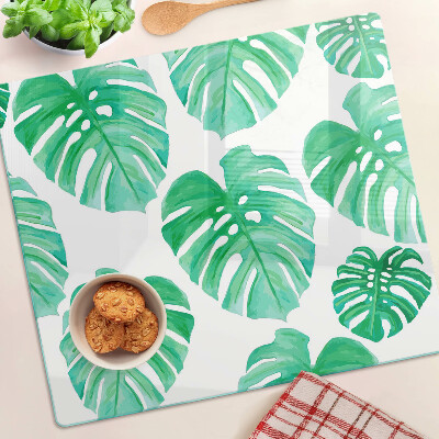 Tabla para cortar Hojas de monstera sobre fondo blanco