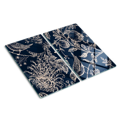Tabla de cortar de cristal Flores y pájaros sobre un fondo oscuro.