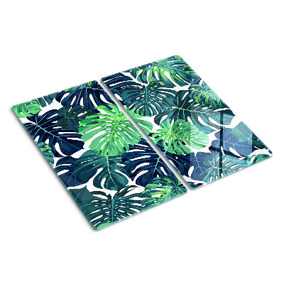 Tabla para cortar Hojas de monstera sobre un fondo tropical