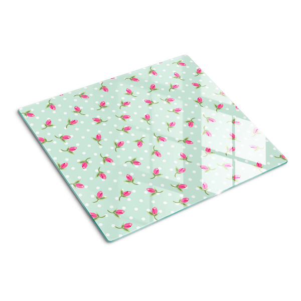 Tabla para cortar Tulipanes rosados sobre un fondo verde