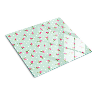 Tabla para cortar Tulipanes rosados sobre un fondo verde