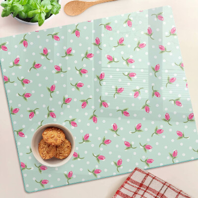 Tabla para cortar Tulipanes rosados sobre un fondo verde
