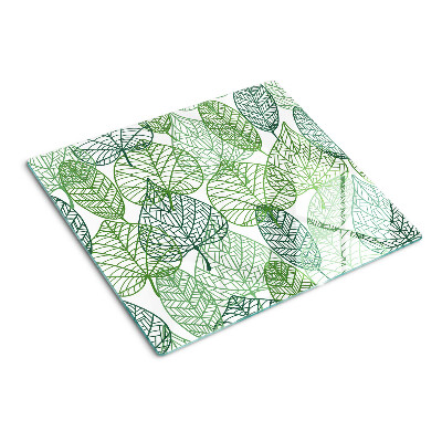 Tabla de cortar de cristal Hojas en diferentes tonos de verde.