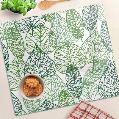 Tabla de cortar de cristal Hojas en diferentes tonos de verde.