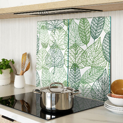 Tabla de cortar de cristal Hojas en diferentes tonos de verde.