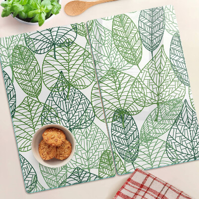 Tabla de cortar de cristal Hojas en diferentes tonos de verde.