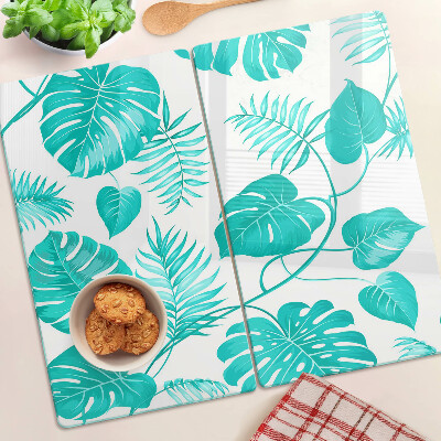 Tabla de cortar de cristal Hojas tropicales en tonos verdes.