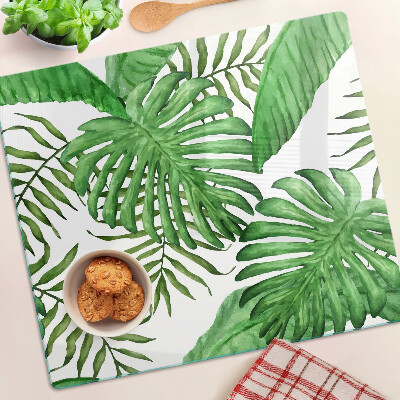 Tabla para cortar Hojas tropicales en tonos verdes.