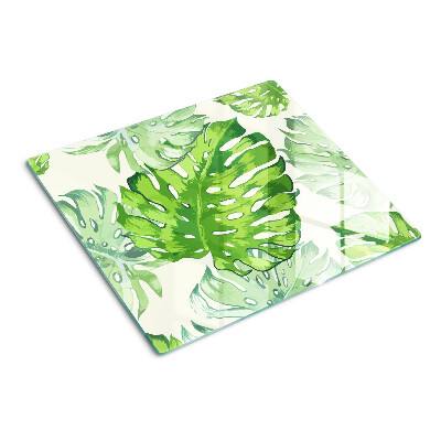 Tabla para cortar Hojas de monstera sobre un fondo claro