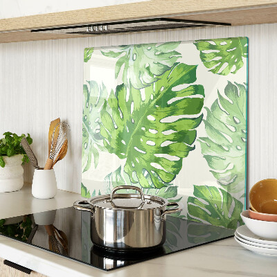 Tabla para cortar Hojas de monstera sobre un fondo claro