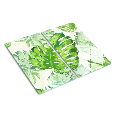 Tabla para cortar Hojas de monstera sobre un fondo claro
