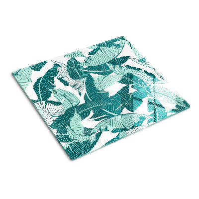 Tabla para cortar Hojas tropicales en tonos verdes.
