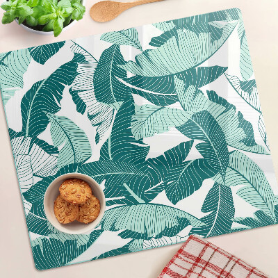 Tabla para cortar Hojas tropicales en tonos verdes.