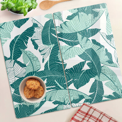 Tabla para cortar Hojas tropicales en tonos verdes.