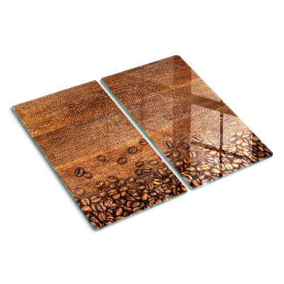 Tabla de cortar de cristal Granos de café sobre fondo de madera