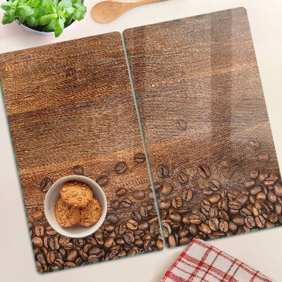 Tabla de cortar de cristal Granos de café sobre fondo de madera