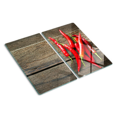 Tabla de cortar de cristal Chiles sobre un fondo de madera