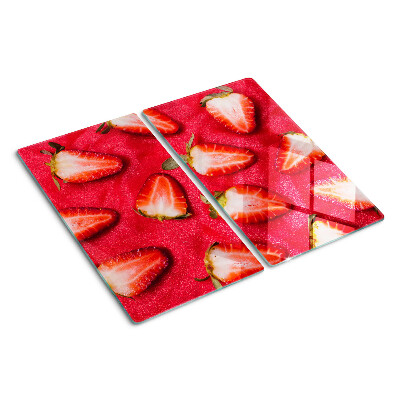 Tabla de cortar de cristal Fresas sobre un fondo rosa