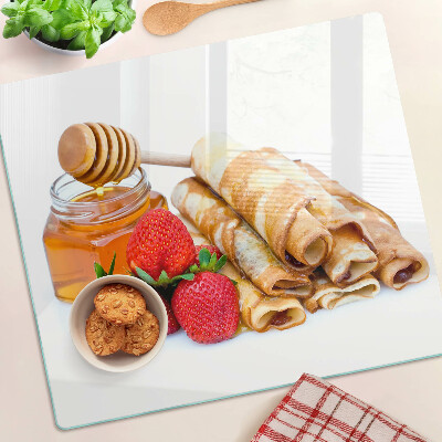 Tabla para cortar Panqueques con miel y fresas