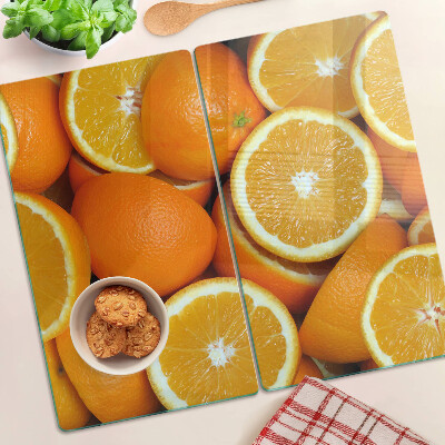 Tabla de cortar de cristal naranjas en rodajas