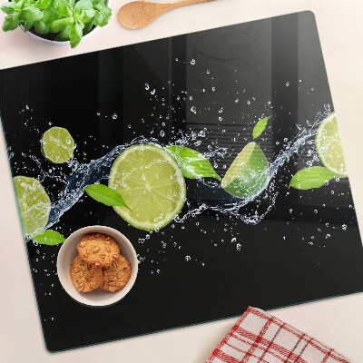 Tabla de cortar de cristal Limones en agua con hojas de menta