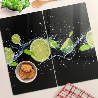 Tabla de cortar de cristal Limones en agua con hojas de menta