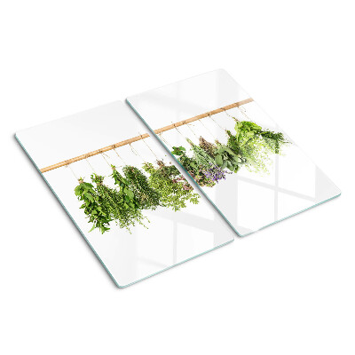 Tabla de cortar de cristal Hierbas secas en una cuerda