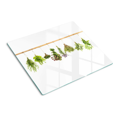 Tabla de cortar de cristal Hierbas secadas en una cuerda