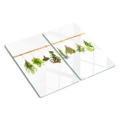 Tabla de cortar de cristal Hierbas secadas en una cuerda