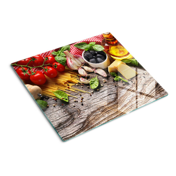 Tabla de cortar de cristal Cocina italiana con pasta y verduras.