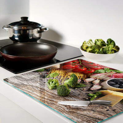 Tabla de cortar de cristal Cocina italiana con pasta y verduras.