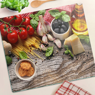 Tabla de cortar de cristal Cocina italiana con pasta y verduras.