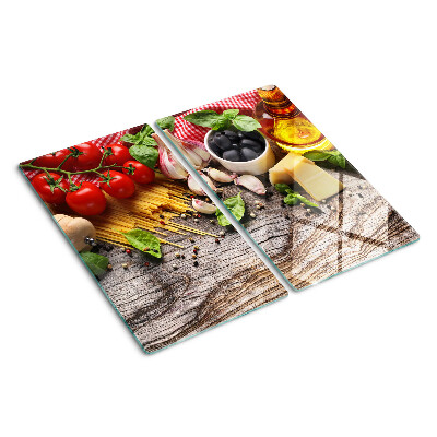 Tabla de cortar de cristal Cocina italiana con pasta y verduras.
