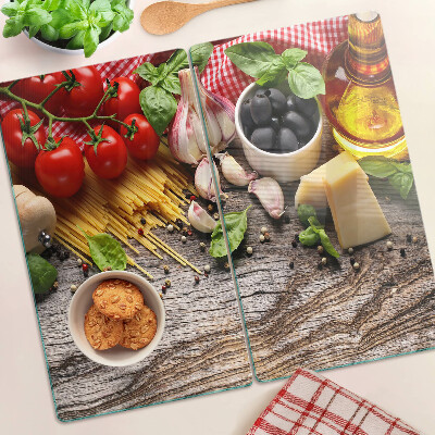 Tabla de cortar de cristal Cocina italiana con pasta y verduras.