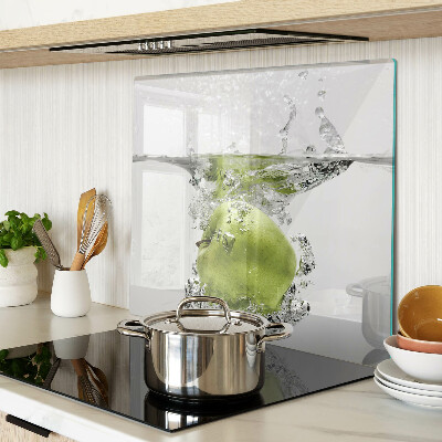 Tabla de cortar de cristal Manzana verde en agua