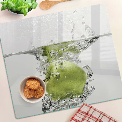 Tabla de cortar de cristal Manzana verde en agua