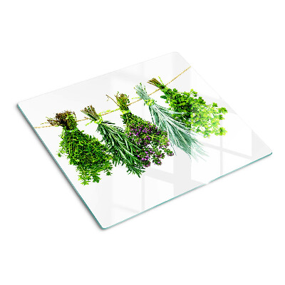 Tabla de cortar de cristal Hierbas secas en una cuerda