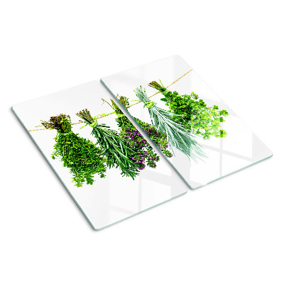 Tabla de cortar de cristal Hierbas secas en una cuerda
