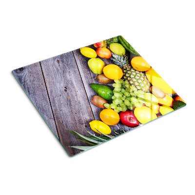 Tabla de cortar de cristal Frutas sobre un fondo de madera