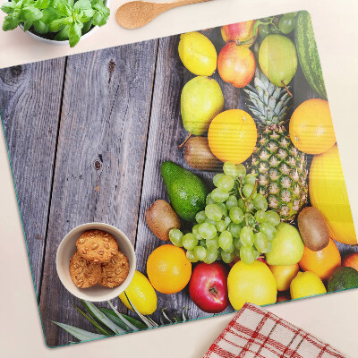 Tabla de cortar de cristal Frutas sobre un fondo de madera