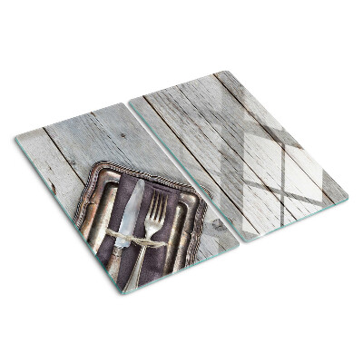 Tabla de cortar de cristal Cubiertos rústicos sobre fondo de madera.